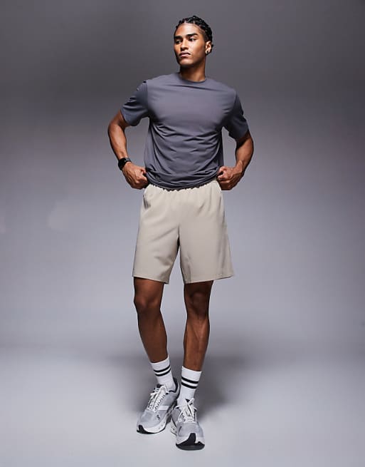 4505 Icon 7 Inch Quick Dry Training Shorts With Zip Pockets In Stone