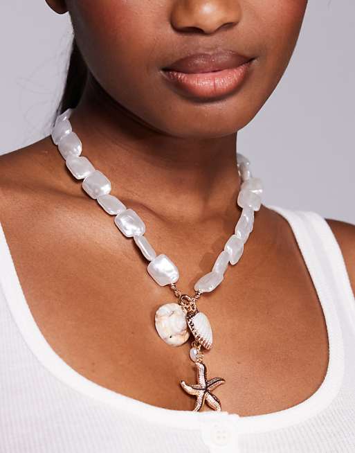 8 Other Reasons statement shell starfish necklace in gold
