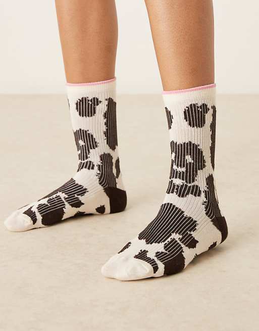 Accessorize cow print socks in black and white