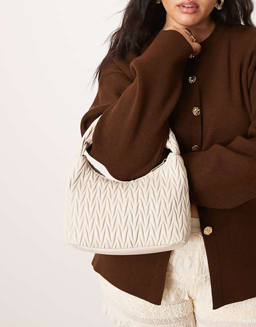 Accessorize quilted handheld bag in cream
