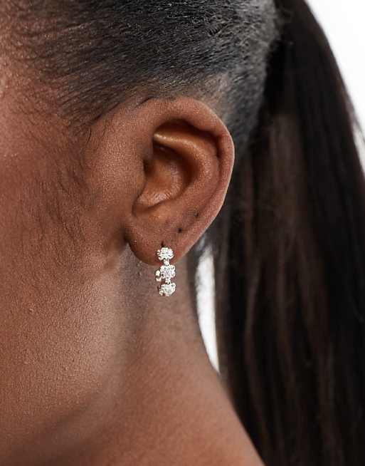 Accessorize sparkle flower huggie hoops in plated stainless steel
