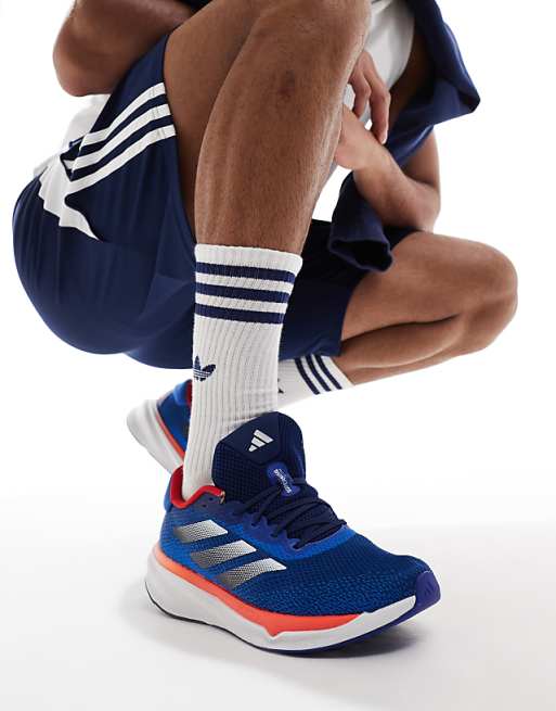 adidas Running Supernova Stride trainers in navy and orange