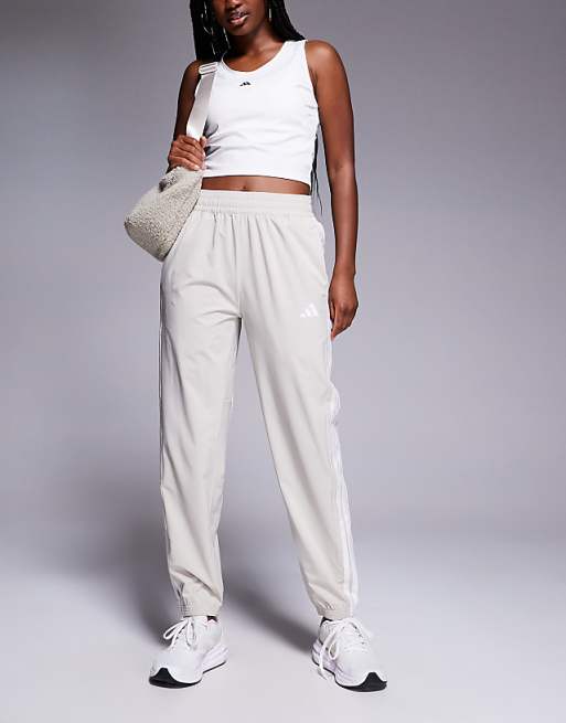 adidas Training 3 stripe woven joggers in stone