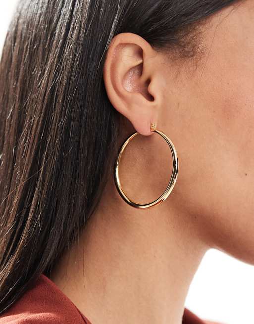 DESIGN 14k gold plated earrings with graduated skinny hoop detail