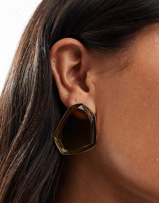 DESIGN asymmetric studs earrings with green crystal stone setting gold tone