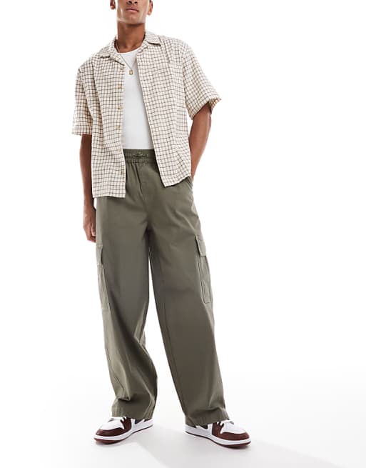 DESIGN baggy pull on cargo trousers in khaki