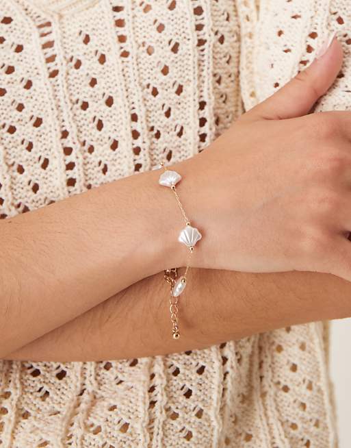 DESIGN bracelet with faux pearl shells in gold tone