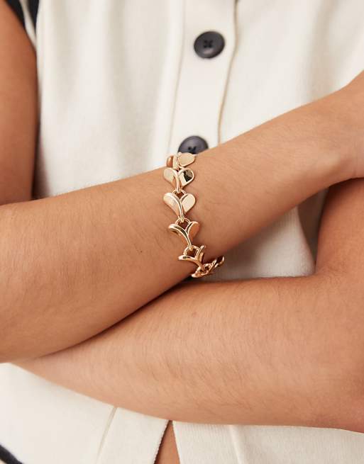 DESIGN bracelet with heart details in gold tone