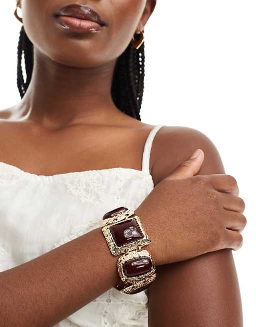 DESIGN bracelet with large burgundy stone-set detail in gold tone
