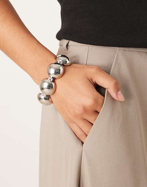 DESIGN bracelet with spherical details in silver tone