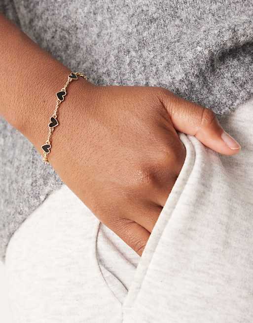 DESIGN chain bracelet with black enamel heart details in gold tone