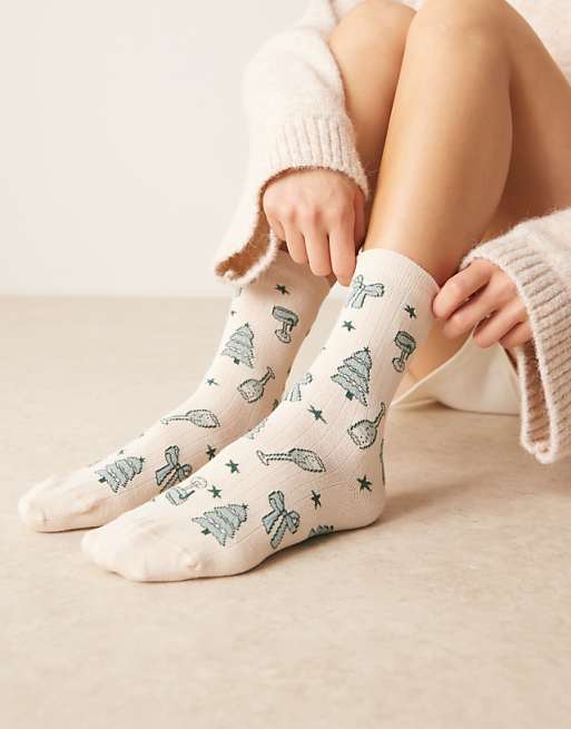 DESIGN christmas all over design socks in cream and green
