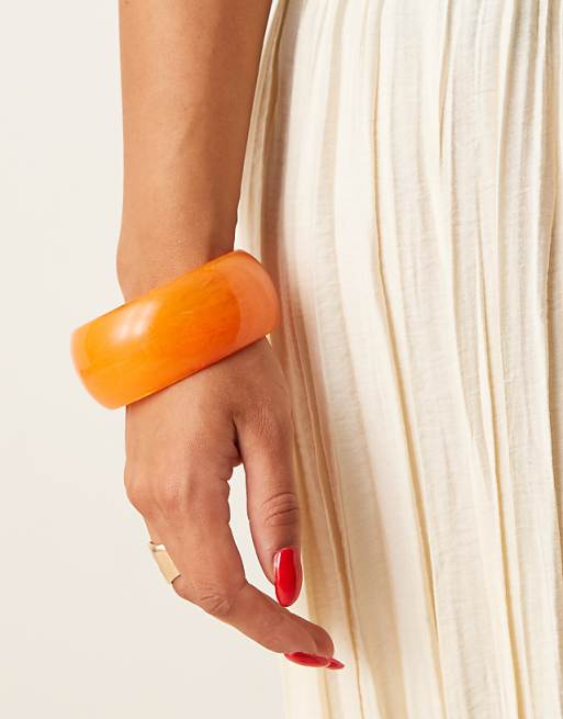DESIGN chunky bangle in bright orange resin