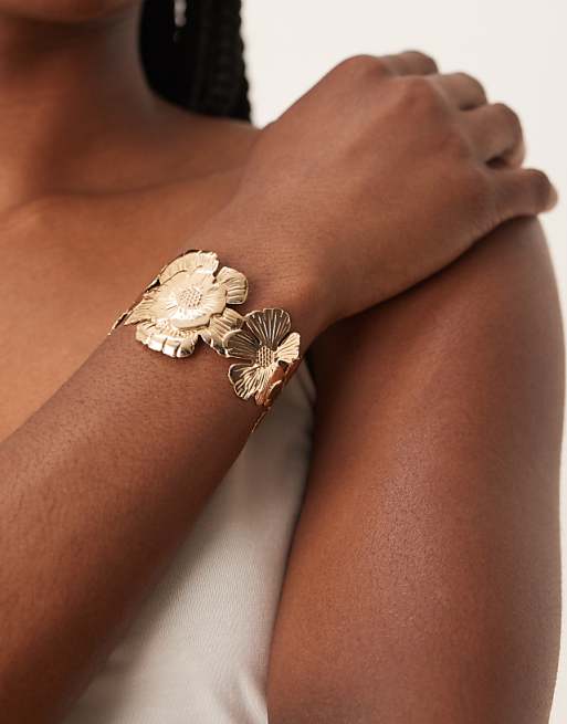 DESIGN cuff bracelet with floral detail in gold tone