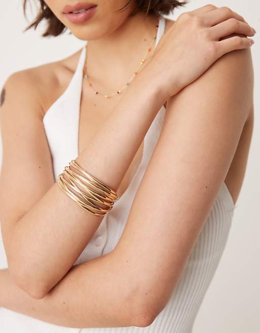 DESIGN cuff bracelet with wire design in gold tone