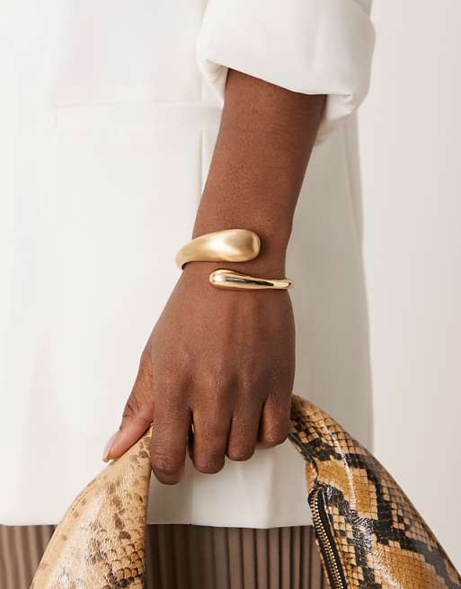 DESIGN cuff bracelet with wrap around molten detail with shiny and brushed gold tone