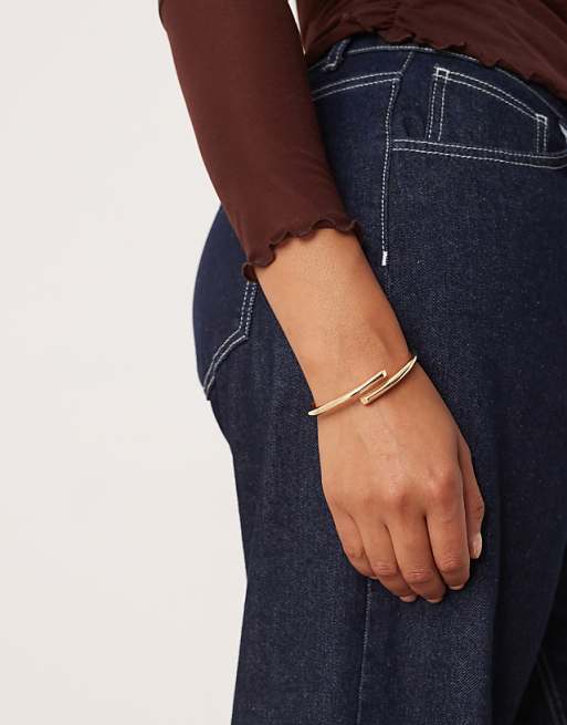 DESIGN Curve cuff bracelet with wrap detail in gold tone