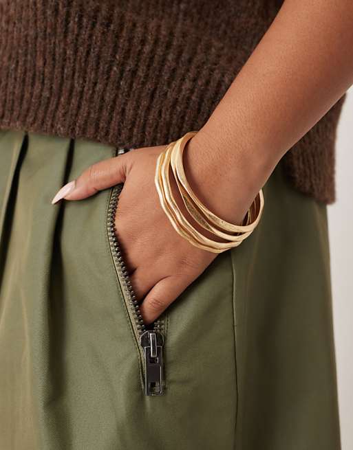 DESIGN Curve pack of bangles with molten design in brushed gold