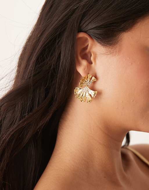 DESIGN drop earrings with crystal and textured leaf design in gold tone
