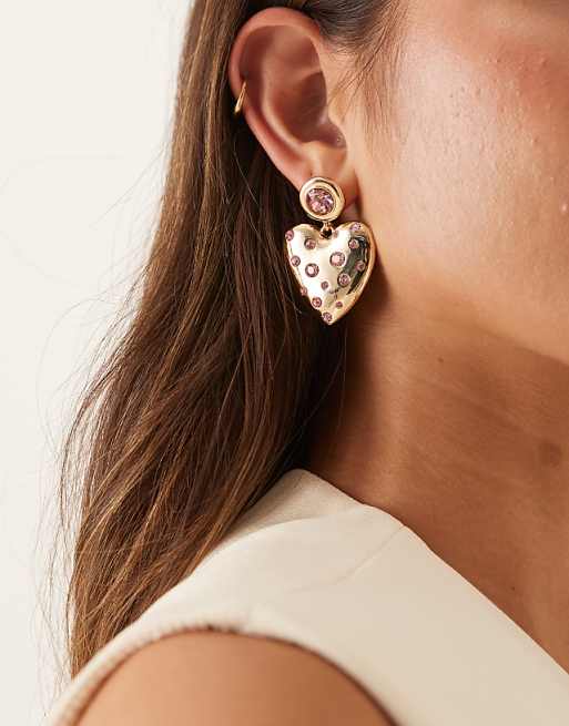 DESIGN earrings in heart design with pink crystal embellishment in gold tone
