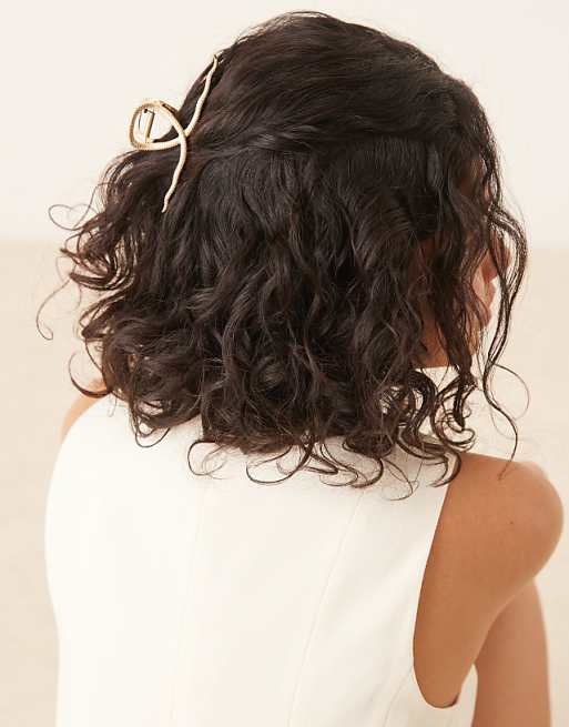 DESIGN hair claw with snake design in gold tone