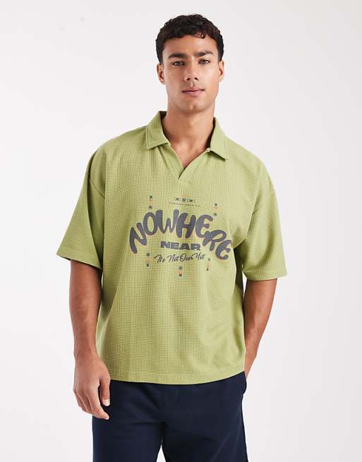 DESIGN heavyweight boxy oversized polo with text graphic in green texture