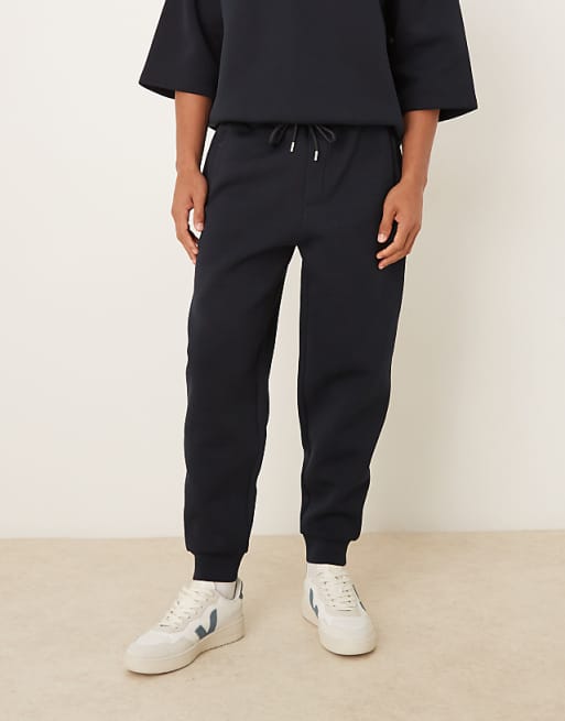 DESIGN heavyweight tapered fit jogger in scuba-style fabric in navy