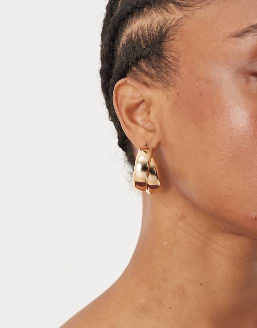 DESIGN hoop earrings with thick crossover design gold tone