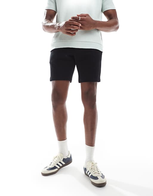 DESIGN jersey skinny shorts in black
