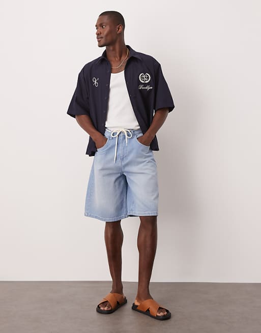 DESIGN long length denim jort with drawcord in light wash blue