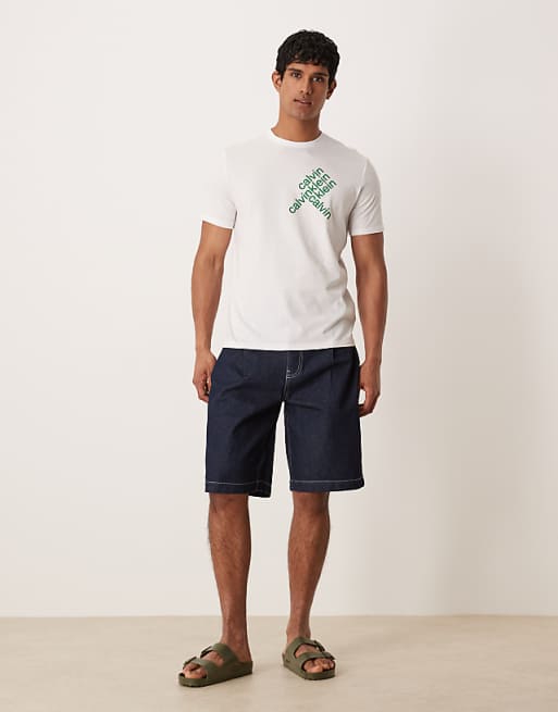 DESIGN long length denim jorts with pocket pleats in raw wash