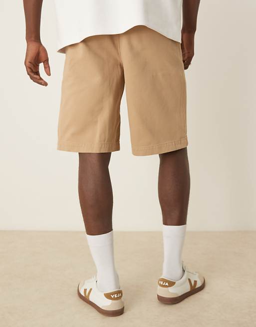 DESIGN Long Length Pleated Shorts With Double Darts In Beige