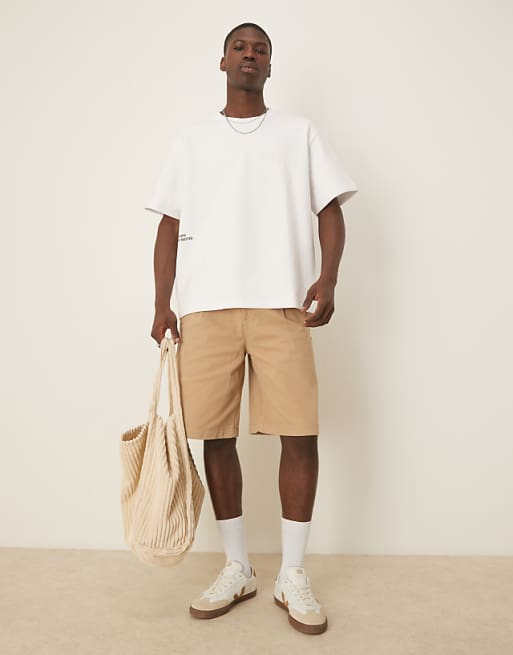 DESIGN Long Length Pleated Shorts With Double Darts In Beige