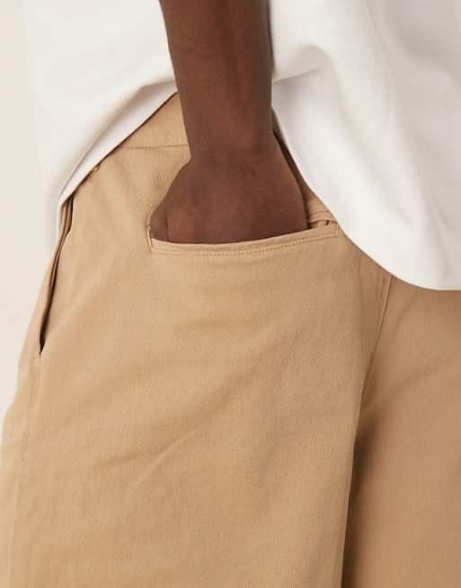 DESIGN Long Length Pleated Shorts With Double Darts In Beige