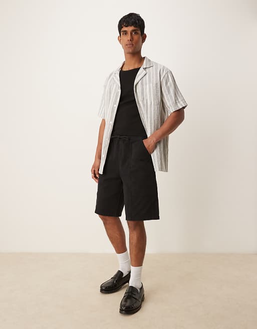 DESIGN long length pull on cargo shorts in black