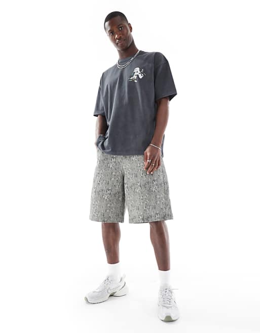 DESIGN long length shorts in camo