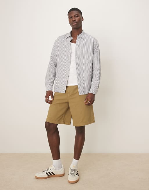 DESIGN long length shorts in olive green