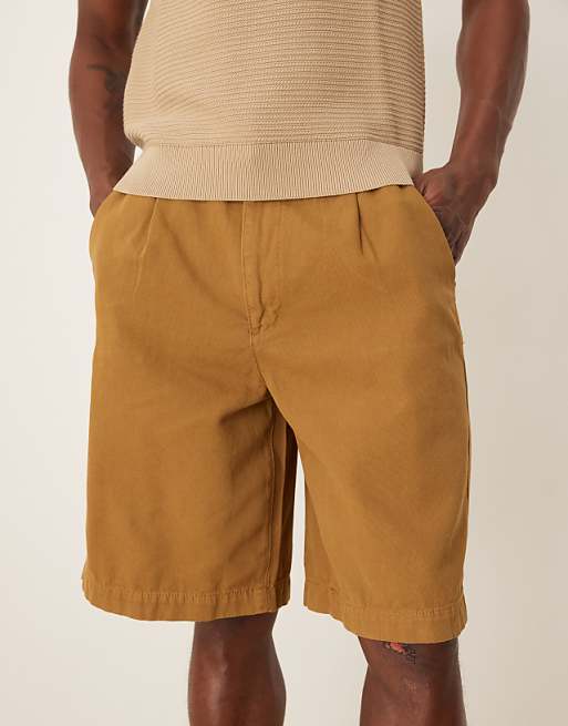 DESIGN long length shorts with pleats and double darts in tan