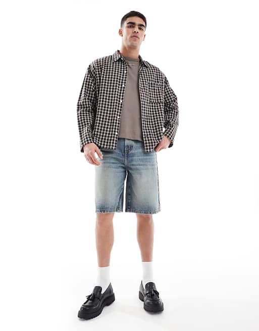 DESIGN longer length denim jort in light wash blue with tint