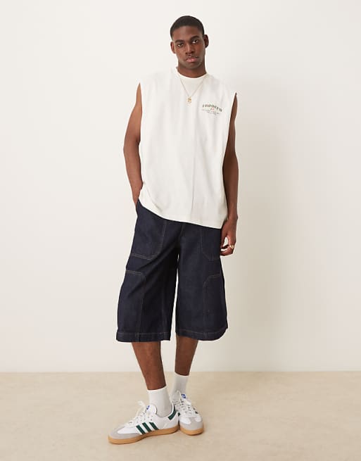 DESIGN longer length denim jort in mid wash blue