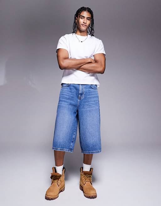 DESIGN longer length denim jort in mid wash blue