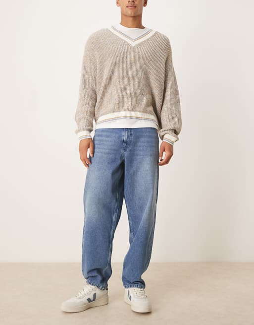 DESIGN loose straight fit jeans in midwash blue with raw hem styling