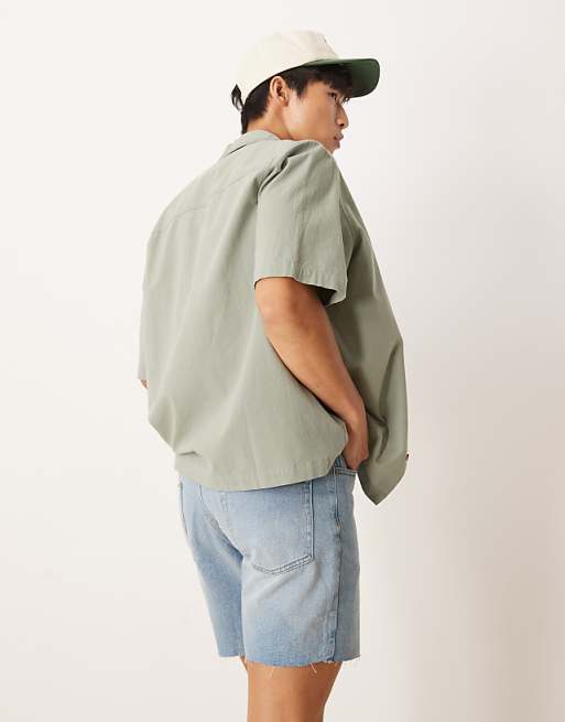 DESIGN Mid Length Slim Denim Shorts With Rips In Light Wash Blue
