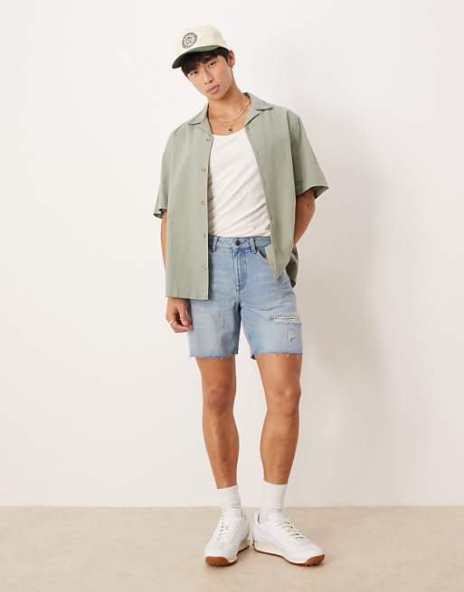DESIGN mid length slim denim shorts with rips in light wash blue