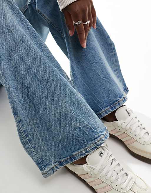 DESIGN Mid Rise Flare Jeans In Light Vintage Wash
