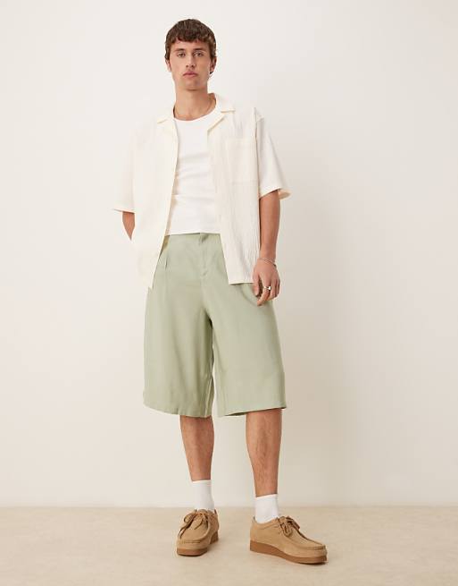 DESIGN oversized bemuda shorts with pleat details in sage