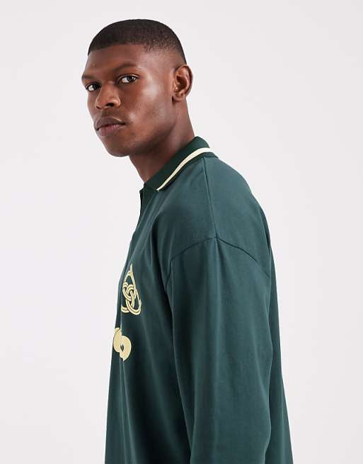 DESIGN Oversized Long Sleeve Polo With Paraiso Graphic In Dark Green