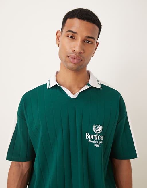 DESIGN oversized polo with sports chest graphic in green