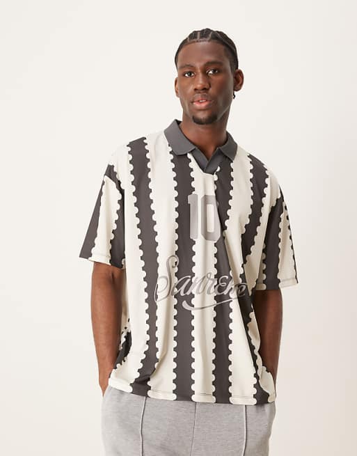 DESIGN oversized polo with sports graphic and all over print