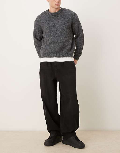 DESIGN oversized tapered jeans in black with pleats